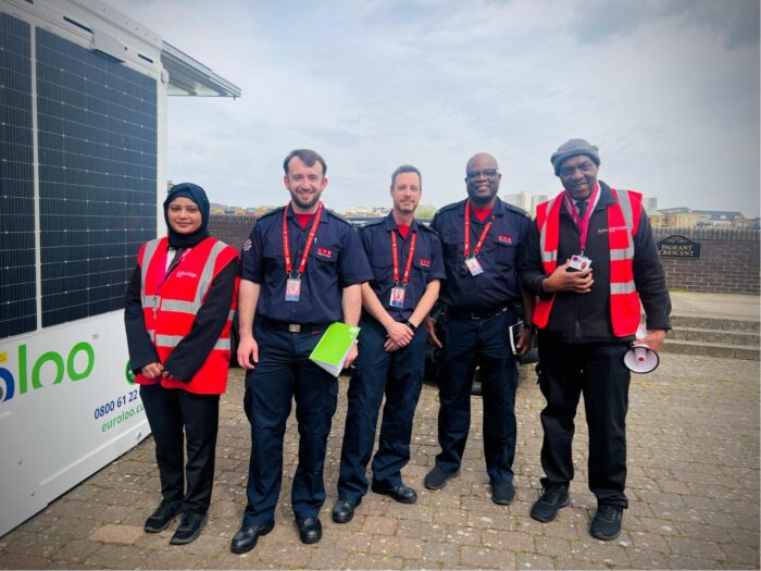 Ashridge Group waking watch officers with a London Fire Brigade crew during a compliance visit at the Rotherhithe Street development, beside the site’s solar welfare cabin